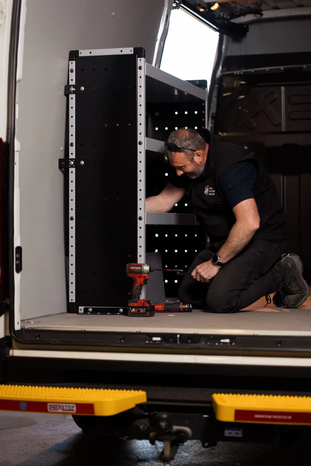 Racking system being fitted inside a welfare van