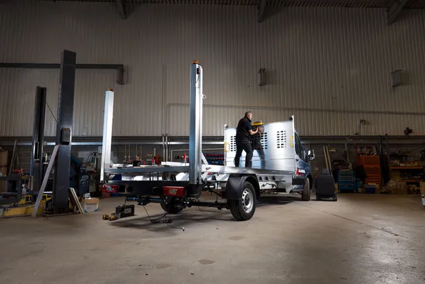 Dack technician working on an aluminium dropside body