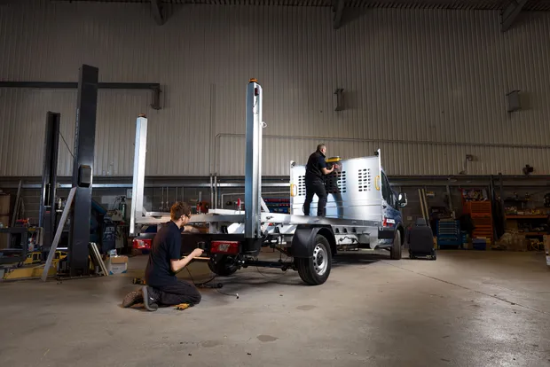 Two Dack technicians assembling a dropside build