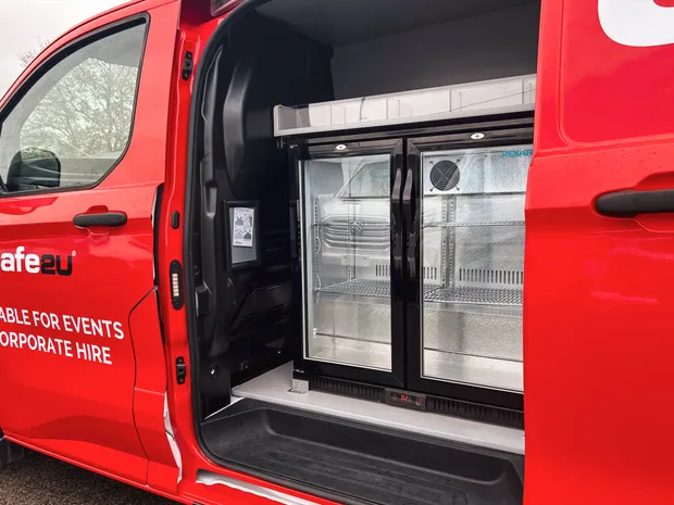 Twin glass-door display fridges inside the Cafe2U van side door