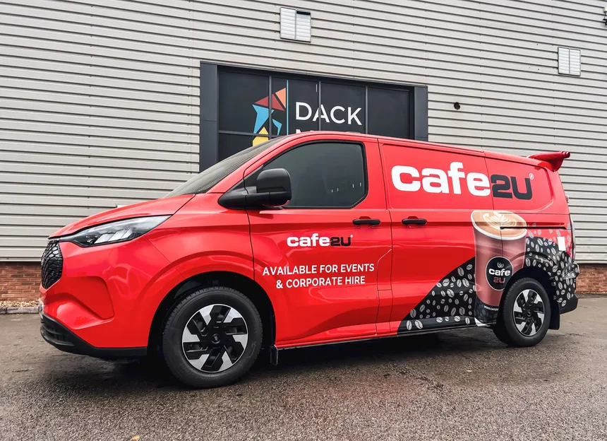 All-electric Cafe2U coffee van in red livery outside the Dack workshop