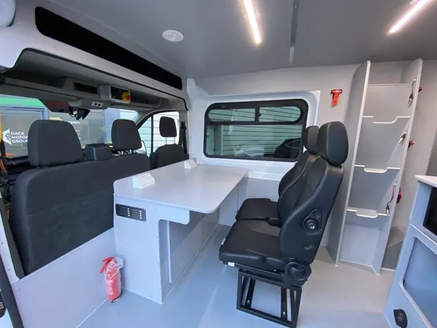 EMCC van crew area with table, swivel seating and charge points