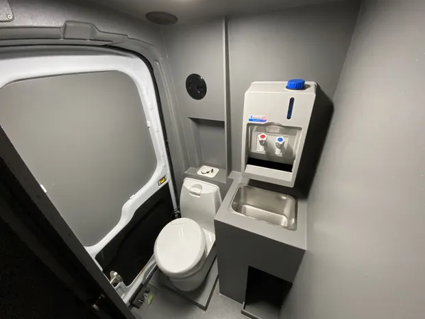 EMCC van onboard washroom with toilet and hot handwash unit