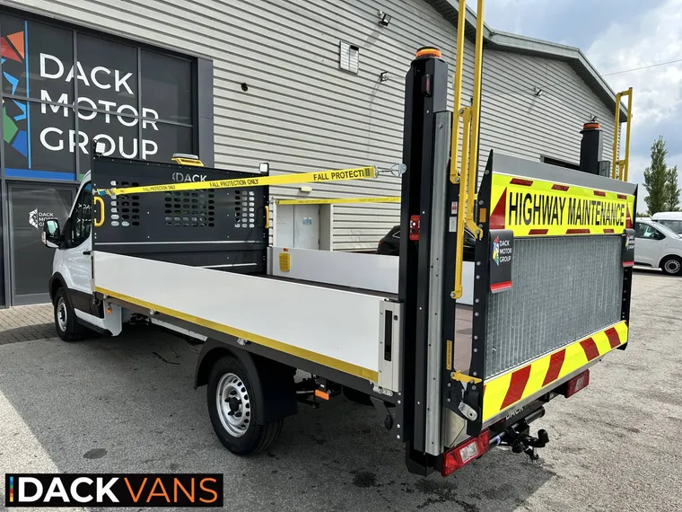 Dropside bed of a 3.5-tonne traffic management vehicle with fall protection straps, raised column tail lift and laser-cut Dack headboard